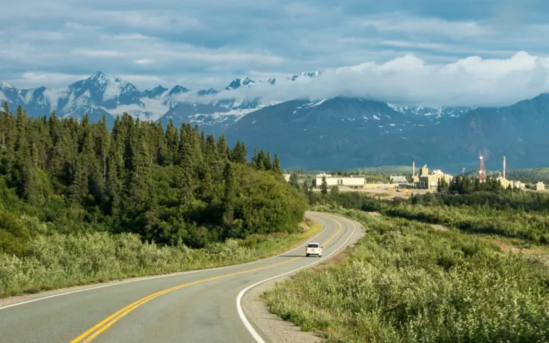 Car at the Richardson highway crossing Alaska mountain range